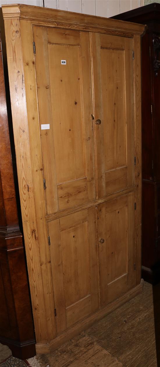 A 19th century pine standing corner cupboard